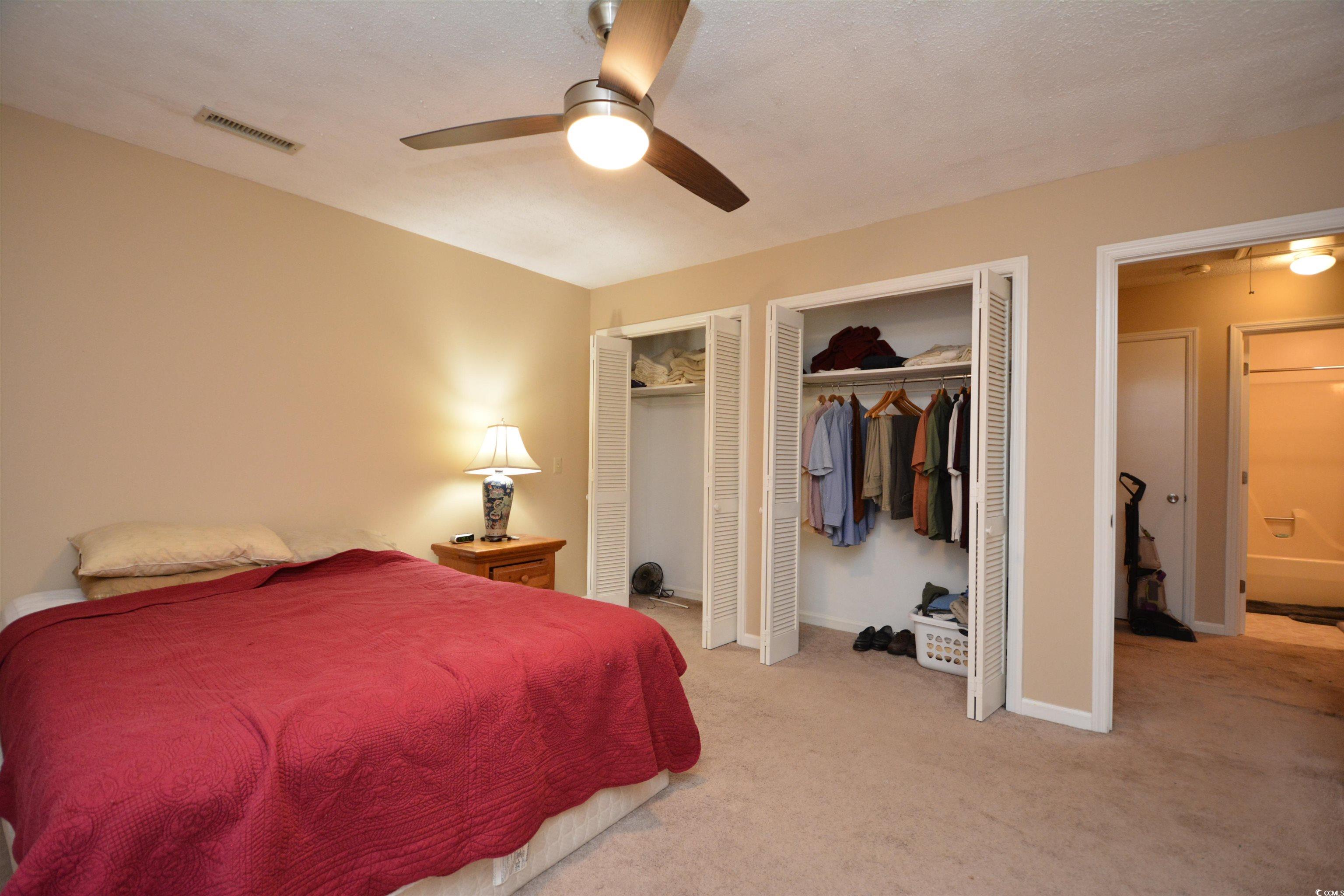 787 Causey Road Murrells Inlet, SC 29576 - Photo 27 of 35 Carpeted bedroom featuring ceiling fan and multipl