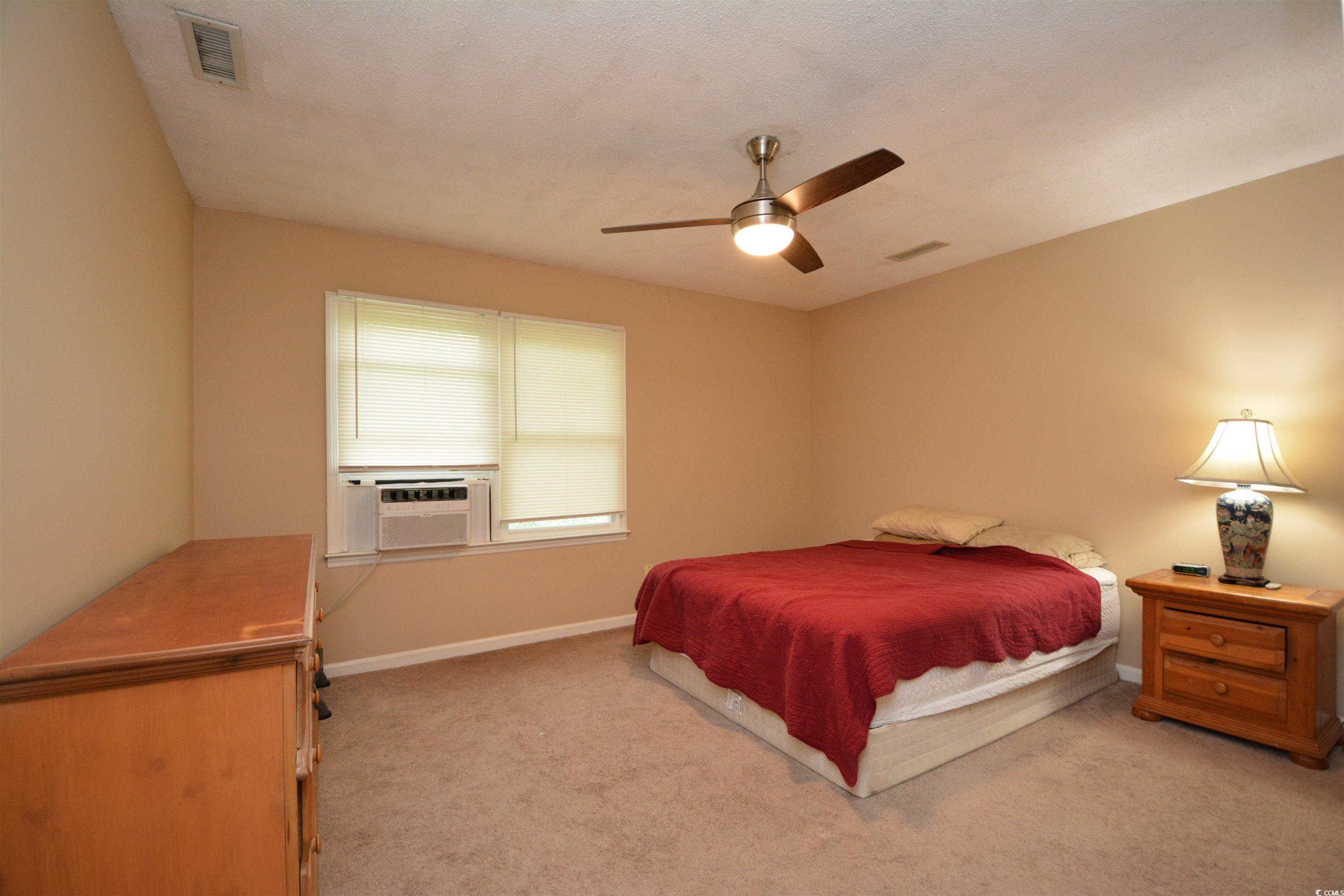 787 Causey Road Murrells Inlet, SC 29576 - Photo 28 of 35 Bedroom featuring light colored carpet, cooling un