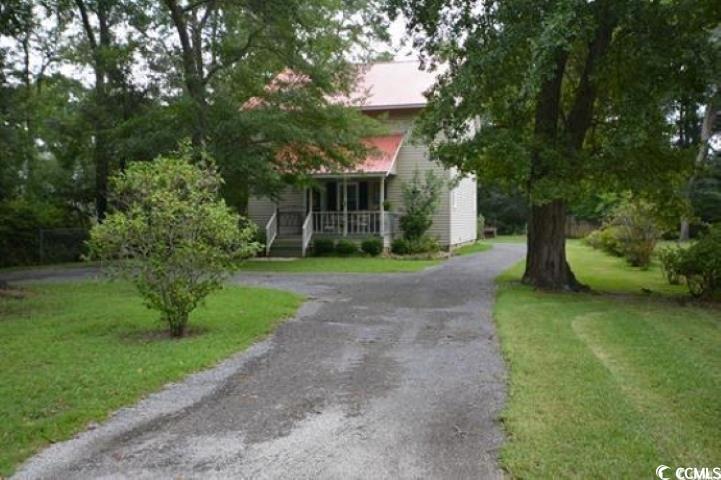 787 Causey Road Murrells Inlet, SC 29576 - Photo 3 of 35 View of property hidden behind natural elements fe