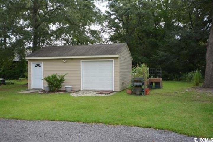 787 Causey Road Murrells Inlet, SC 29576 - Photo 7 of 35 Garage with a lawn