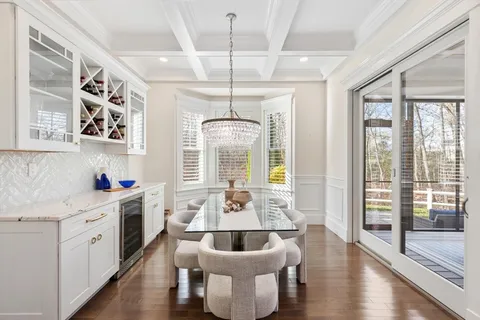 a very nice looking dining room with a large window