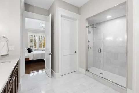 a view of a bathroom with a shower and a sink