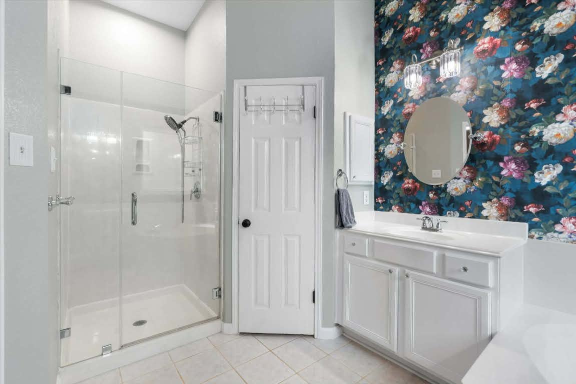 17028 Tortoise Street Round Rock, TX 78664 - Photo 14 of 30 a bathroom with a sink and a mirror