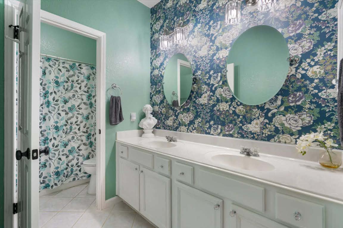 17028 Tortoise Street Round Rock, TX 78664 - Photo 19 of 30 a bathroom with a sink and mirror