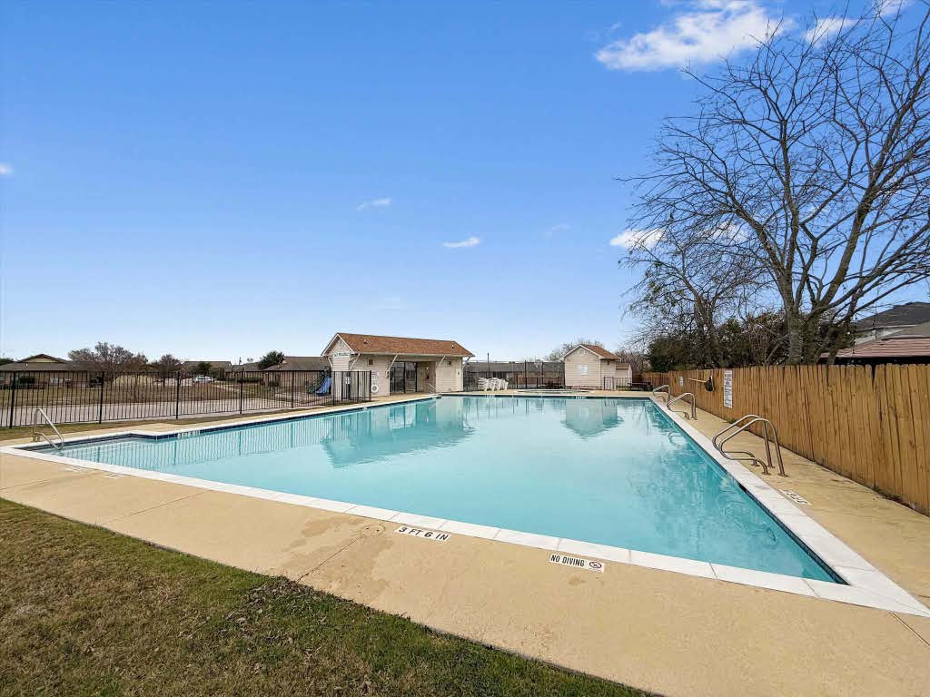 17028 Tortoise Street Round Rock, TX 78664 - Photo 27 of 30 a view of a backyard with a lake view