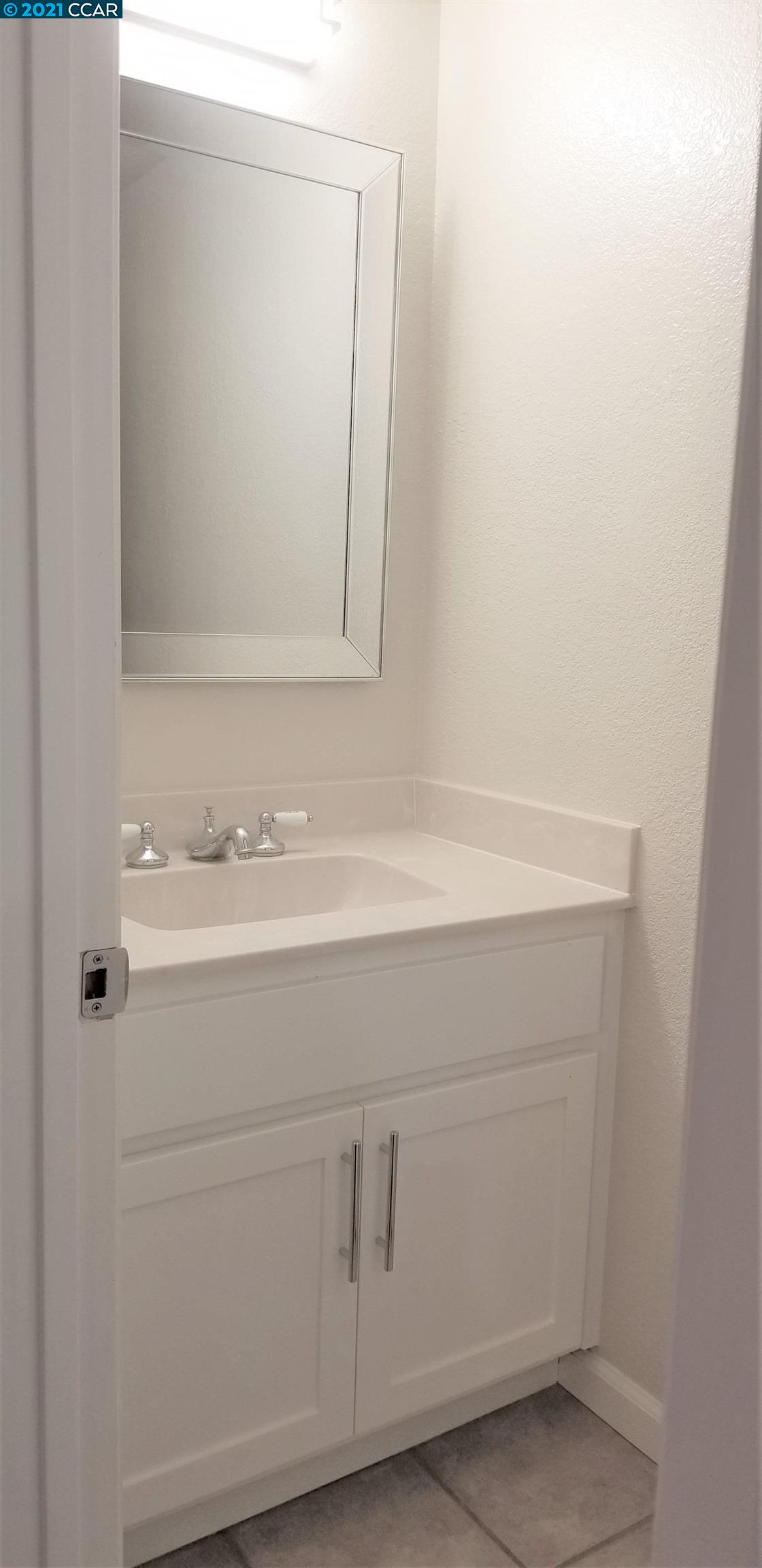 1354 Walden Road Walnut Creek, CA 94597 - Photo 11 of 26 a bathroom with a sink vanity and a mirror