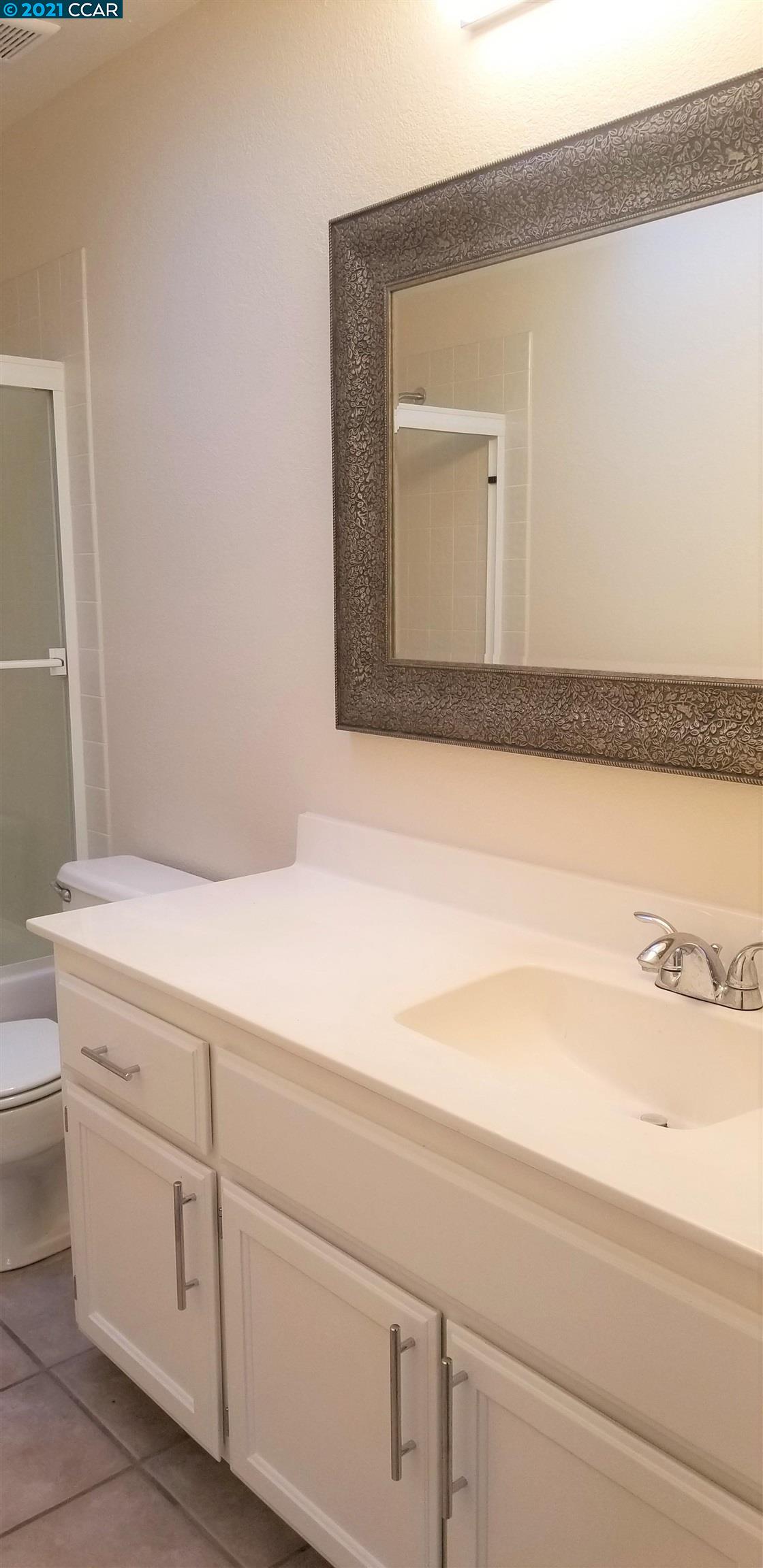 1354 Walden Road Walnut Creek, CA 94597 - Photo 14 of 26 a bathroom with a sink and a mirror