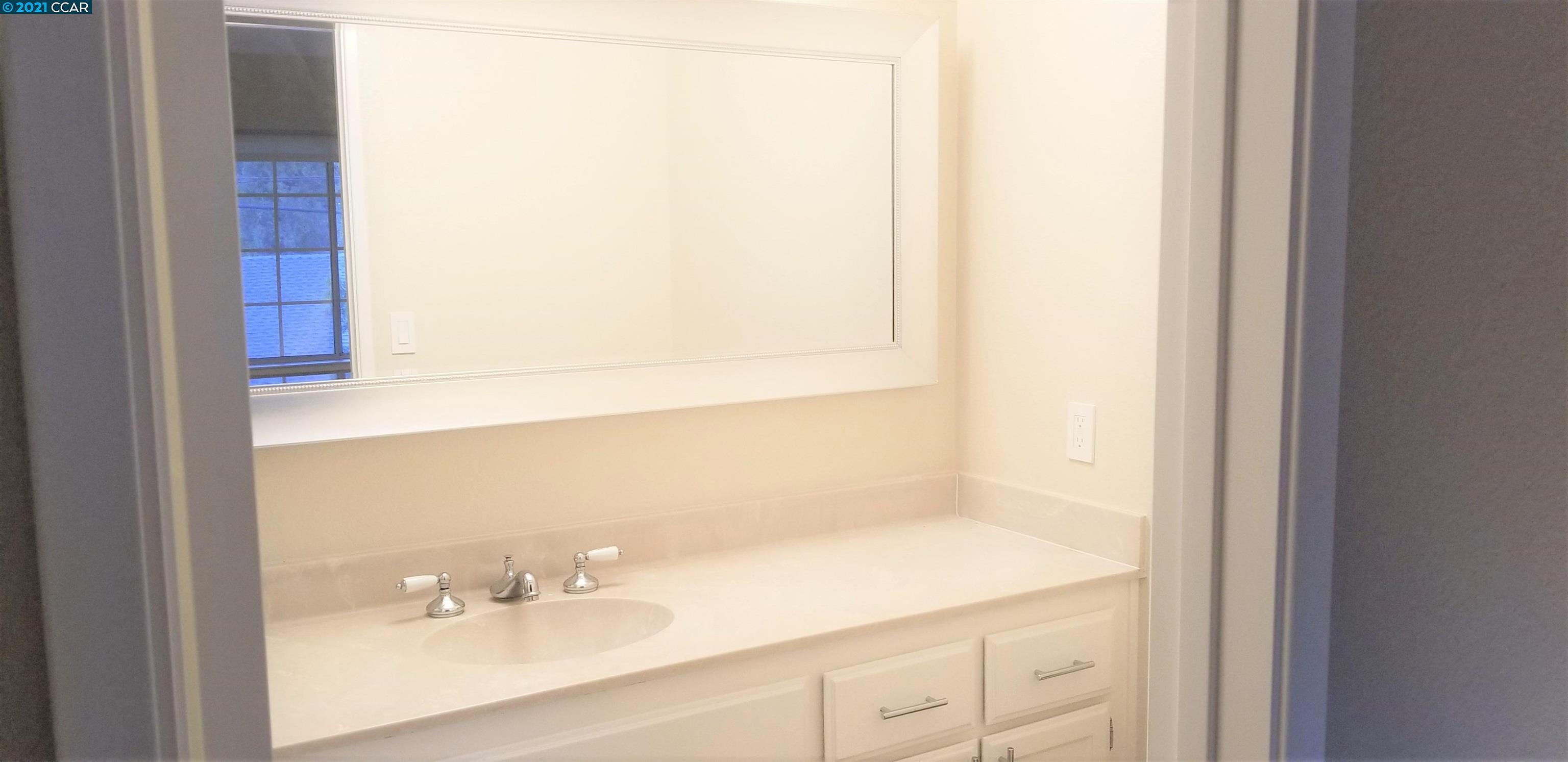 1354 Walden Road Walnut Creek, CA 94597 - Photo 17 of 26 a bathroom with a sink and a mirror