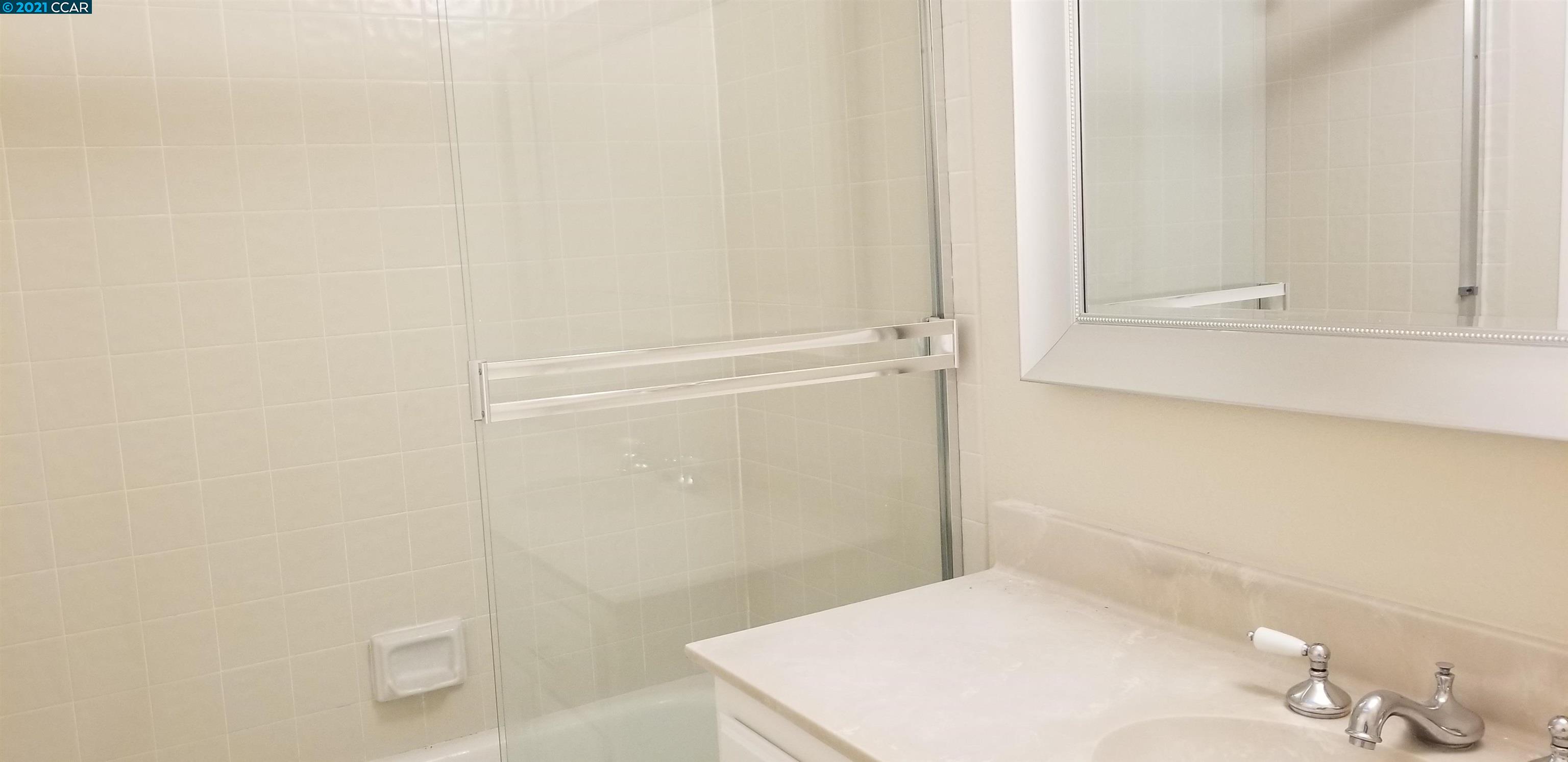 1354 Walden Road Walnut Creek, CA 94597 - Photo 18 of 26 a bathroom with a sink and a mirror