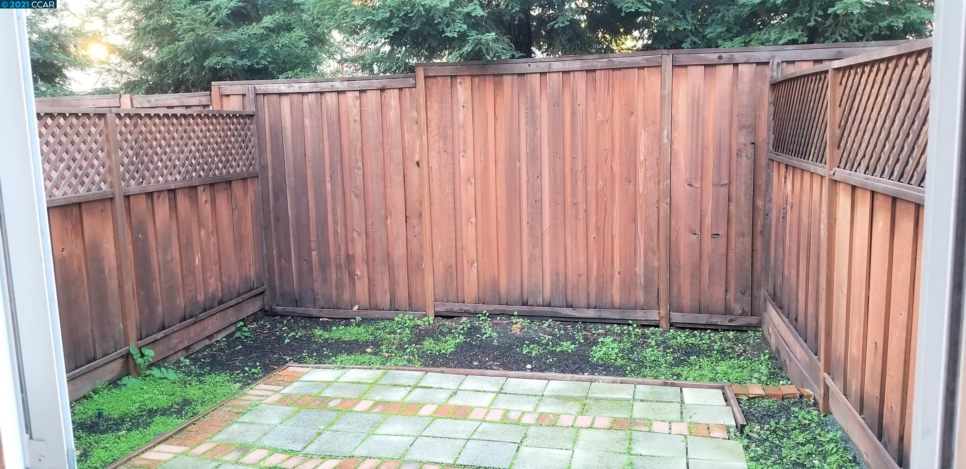 1354 Walden Road Walnut Creek, CA 94597 - Photo 20 of 26 a view of a backyard with wooden fence