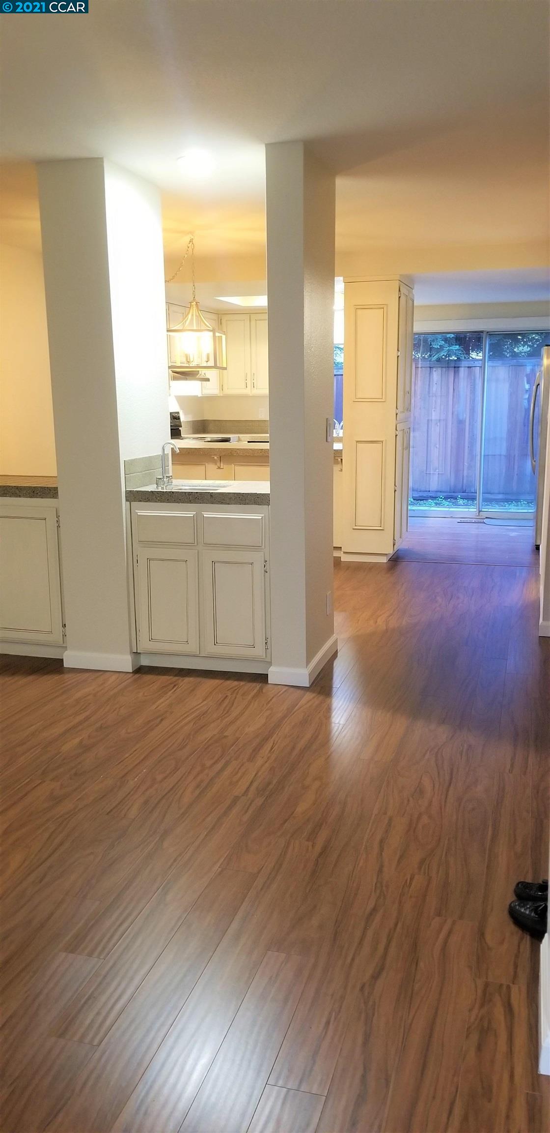 1354 Walden Road Walnut Creek, CA 94597 - Photo 3 of 26 a view of an empty room with wooden floor and a window