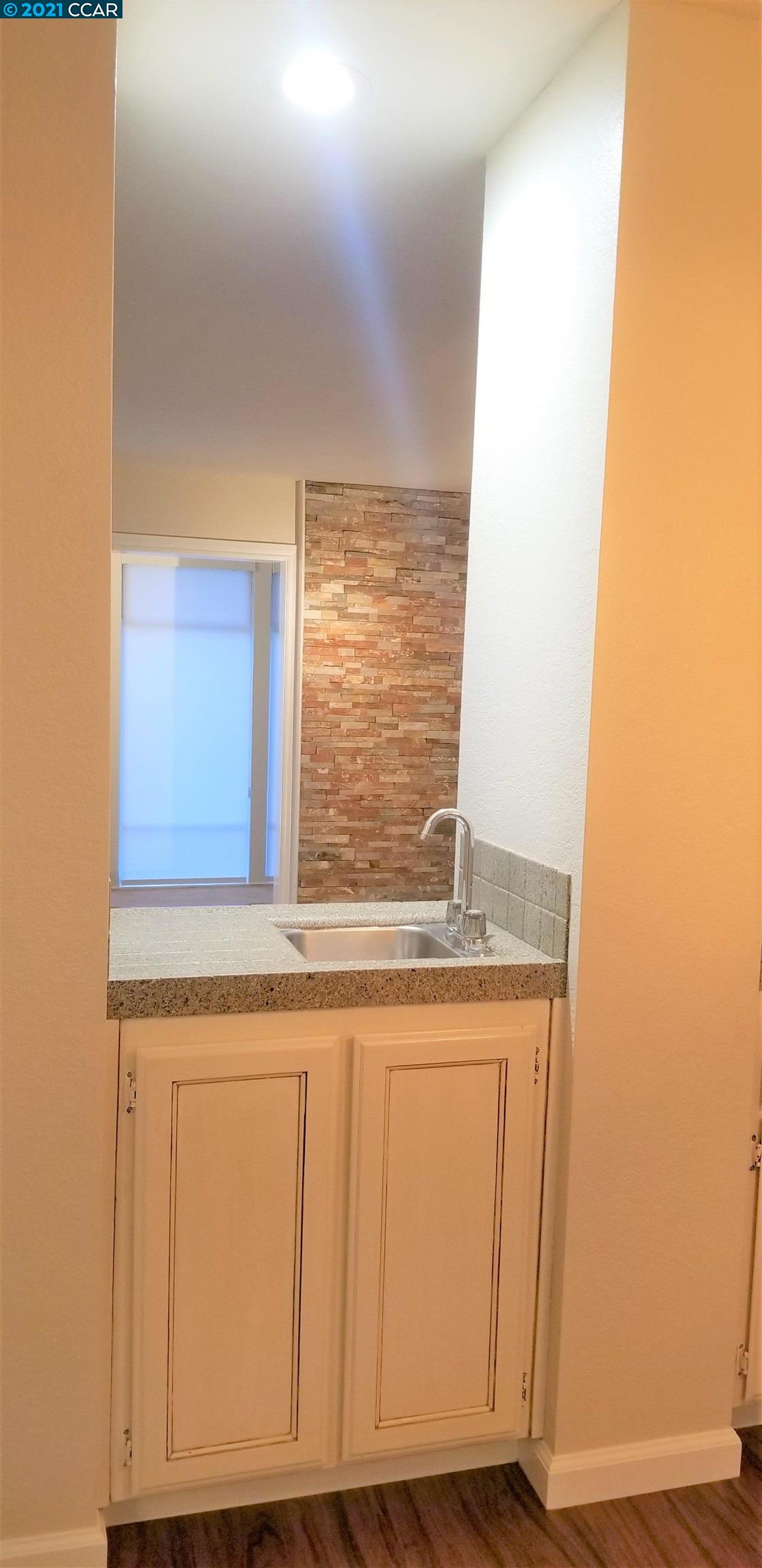 1354 Walden Road Walnut Creek, CA 94597 - Photo 5 of 26 a view of a kitchen with granite countertop cabinets and a sink