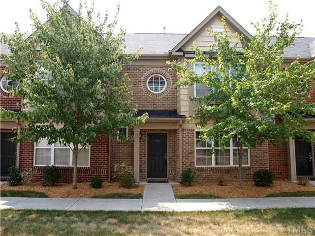 9906 Layla Avenue Raleigh, NC 27617 - Photo 1 of 12 a view of a house with a small yard plants and large tree