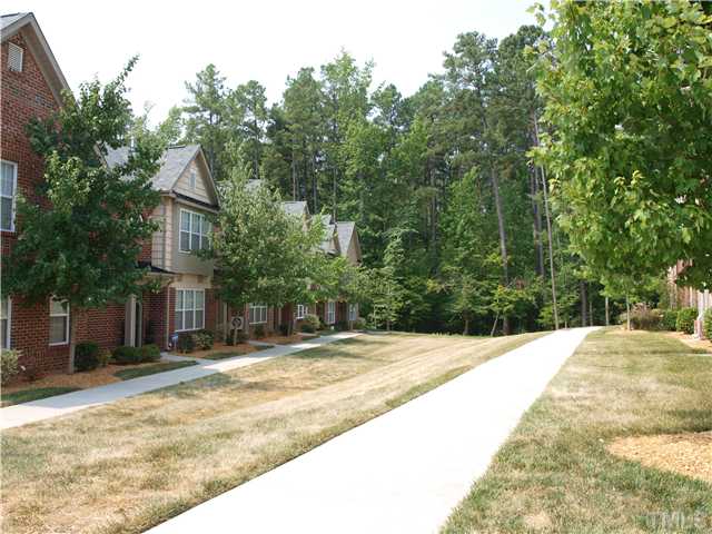 9906 Layla Avenue Raleigh, NC 27617 - Photo 12 of 12 a view of house with yard and trees in the background