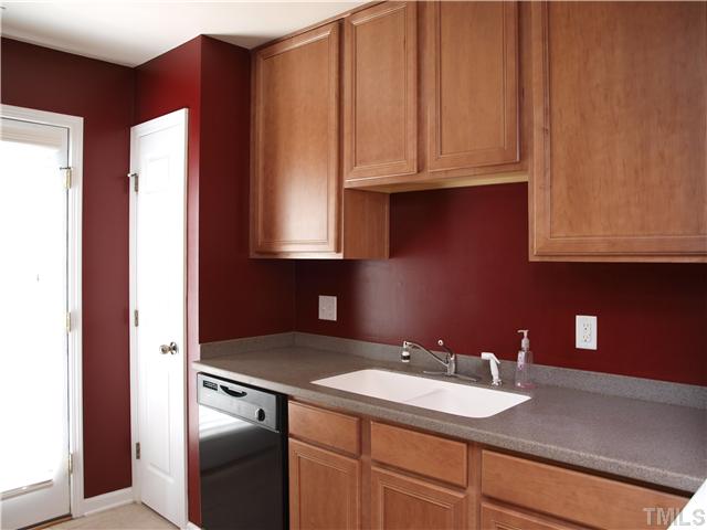 9906 Layla Avenue Raleigh, NC 27617 - Photo 5 of 12 a bathroom with a sink and cabinets