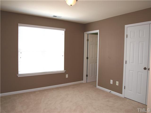 9906 Layla Avenue Raleigh, NC 27617 - Photo 9 of 12 an empty room that has a window