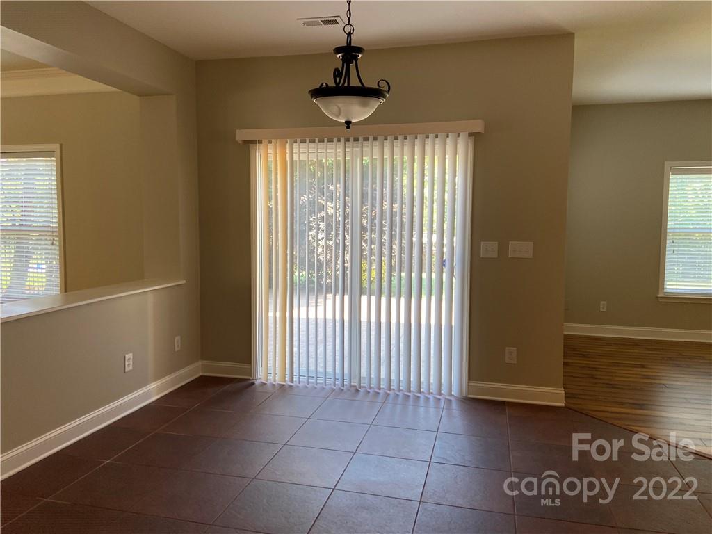 6734 Evanton Loch Road Charlotte, NC 28278 - Photo 18 of 34 a view of an empty room with a window