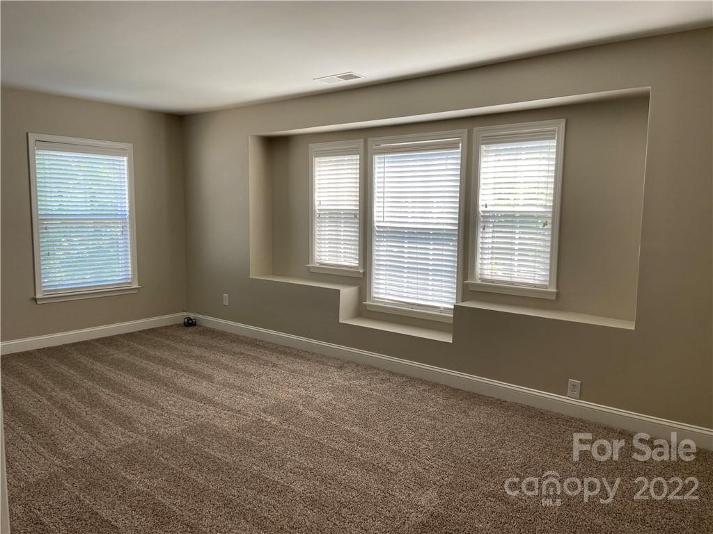 6734 Evanton Loch Road Charlotte, NC 28278 - Photo 24 of 34 a view of an empty room with a window