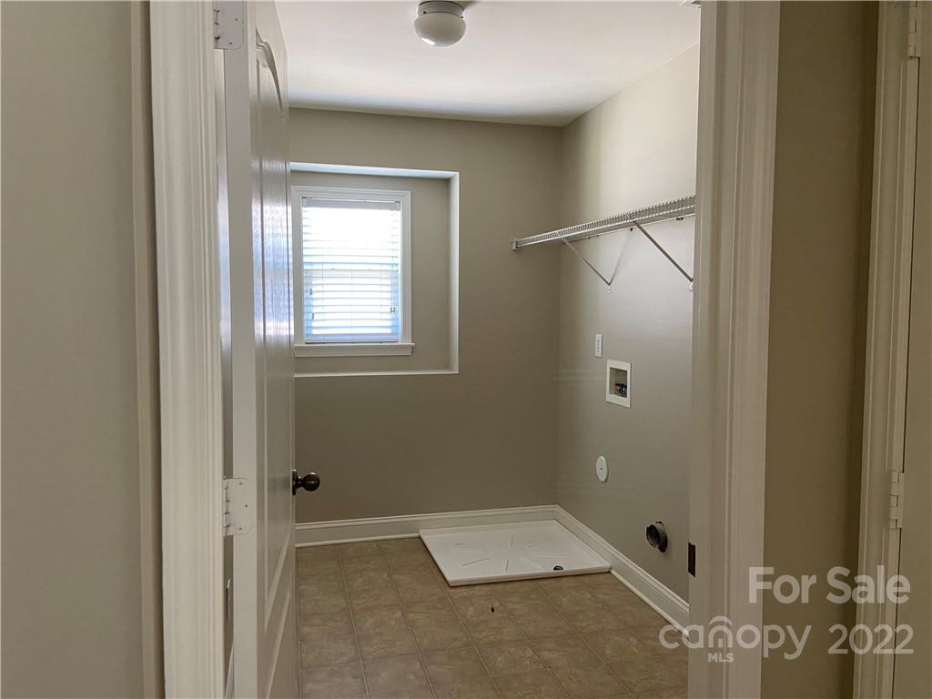 6734 Evanton Loch Road Charlotte, NC 28278 - Photo 31 of 34 a bathroom with a tub and shower