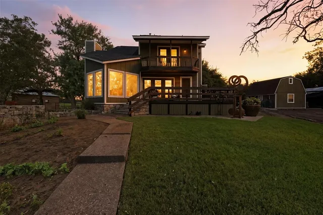 a view of a house with a yard porch and sitting area