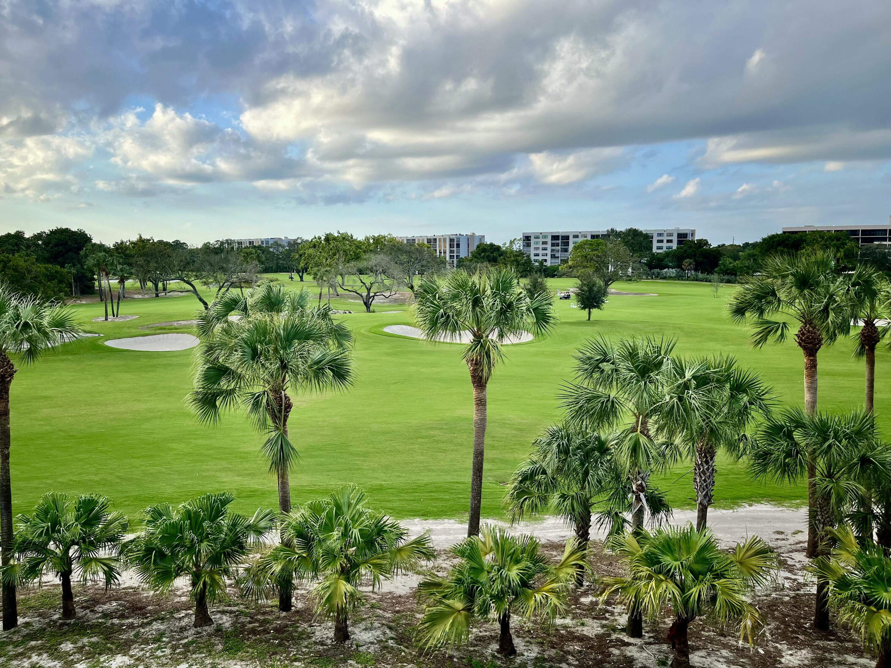 6169 Balboa Circle, Unit 401 Boca Raton, FL 33433 - Photo 1 of 34 a view of a garden with an outdoor seating