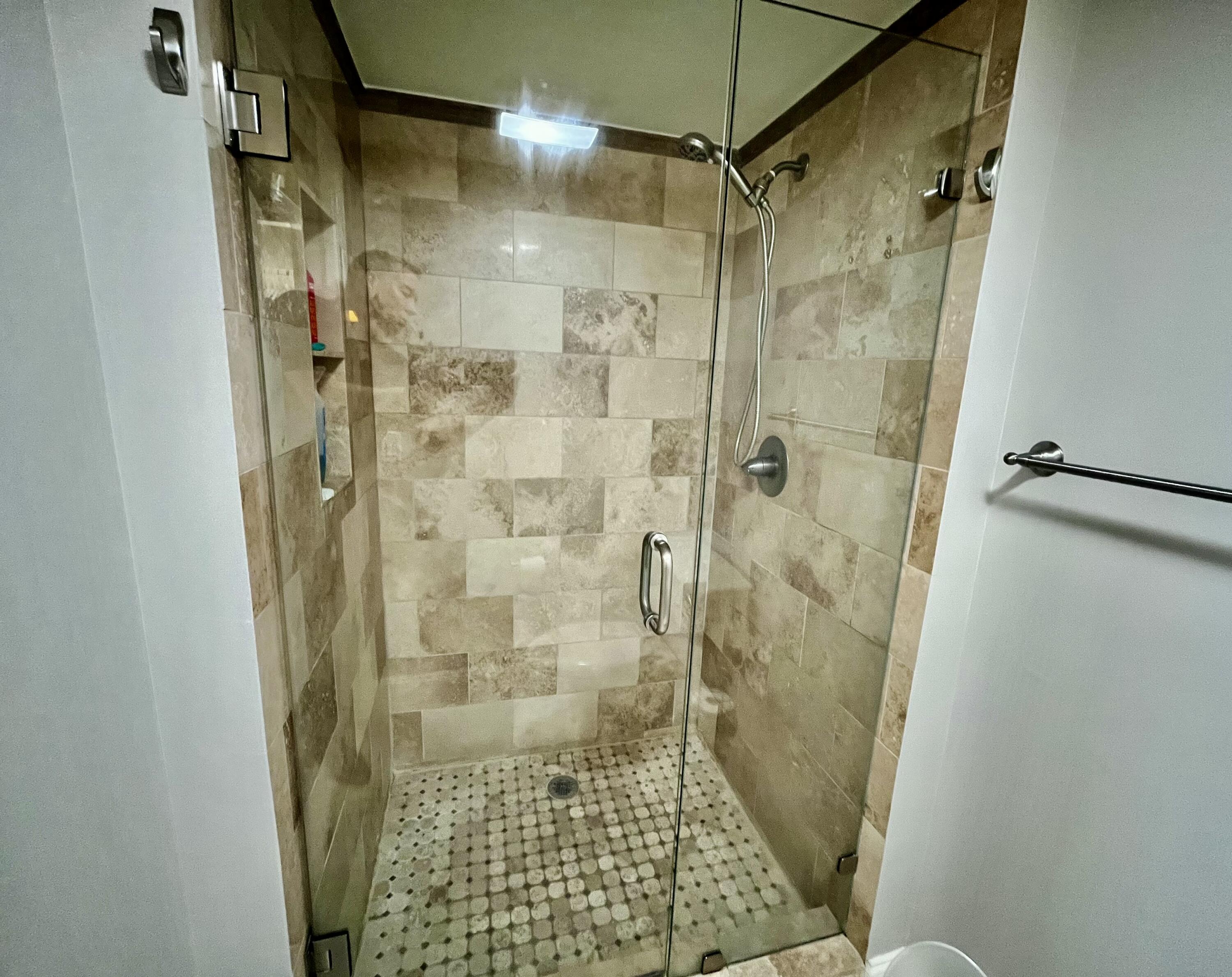 6169 Balboa Circle, Unit 401 Boca Raton, FL 33433 - Photo 21 of 34 a bathroom with a shower