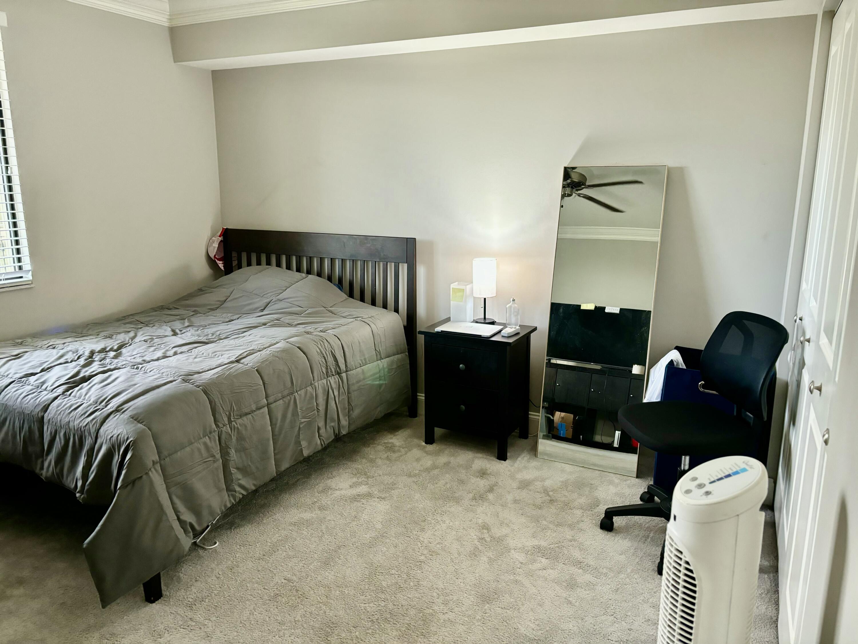 6169 Balboa Circle, Unit 401 Boca Raton, FL 33433 - Photo 24 of 34 a bedroom with a bed window and dresser