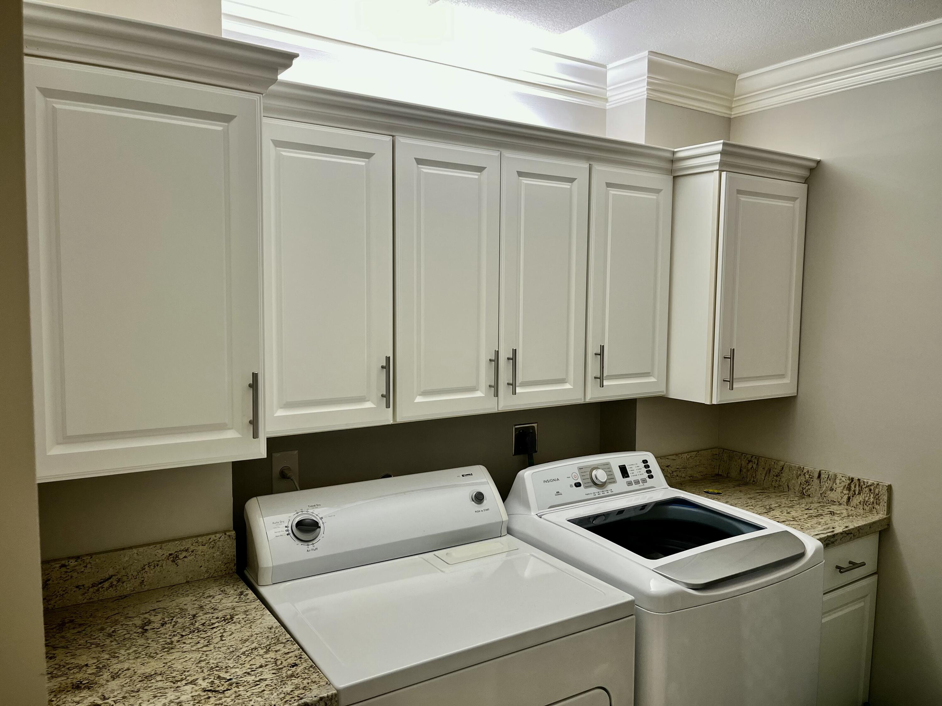 6169 Balboa Circle, Unit 401 Boca Raton, FL 33433 - Photo 27 of 34 a utility room with dryer and washer