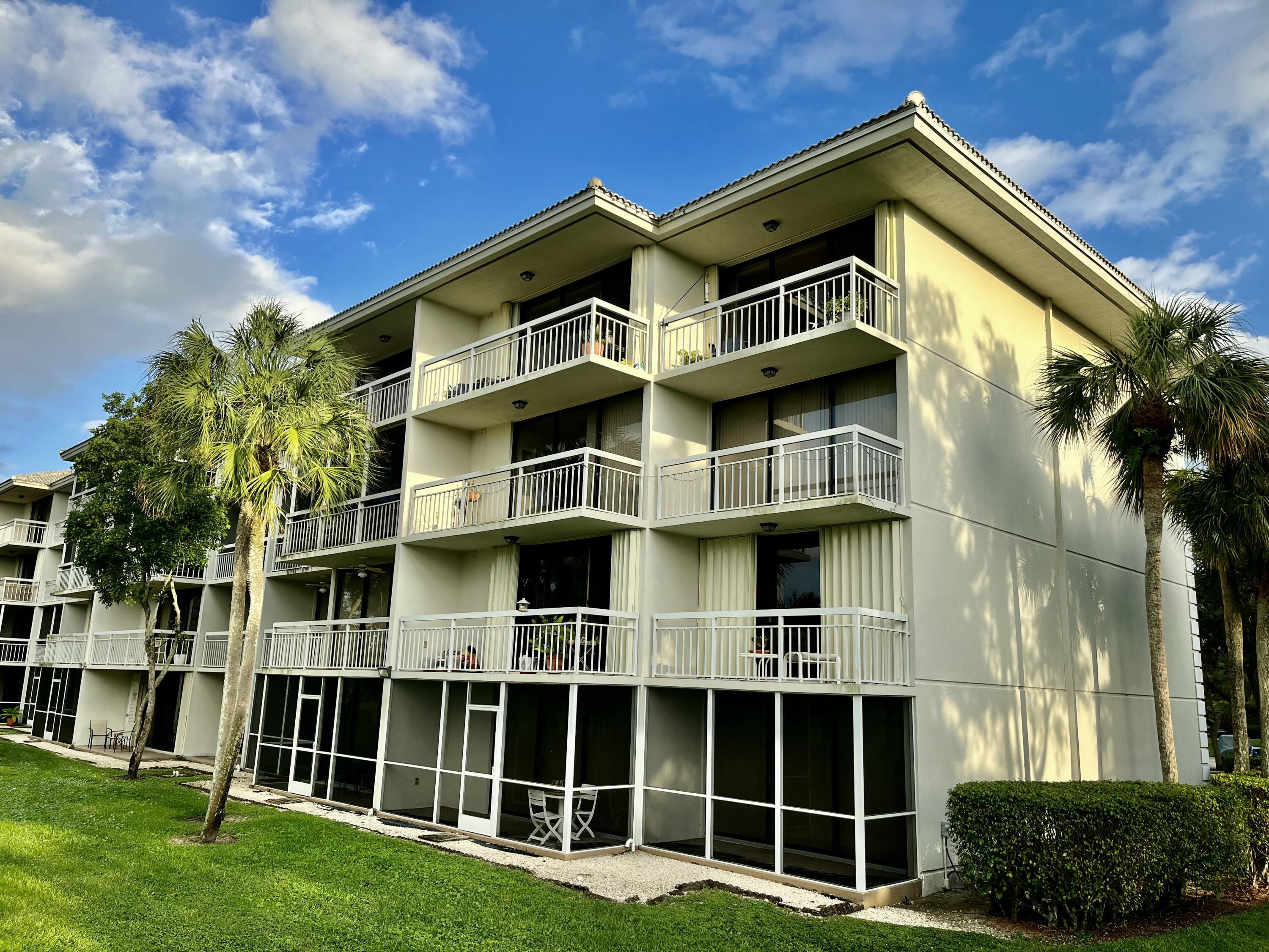 6169 Balboa Circle, Unit 401 Boca Raton, FL 33433 - Photo 33 of 34 a view of a house with a yard