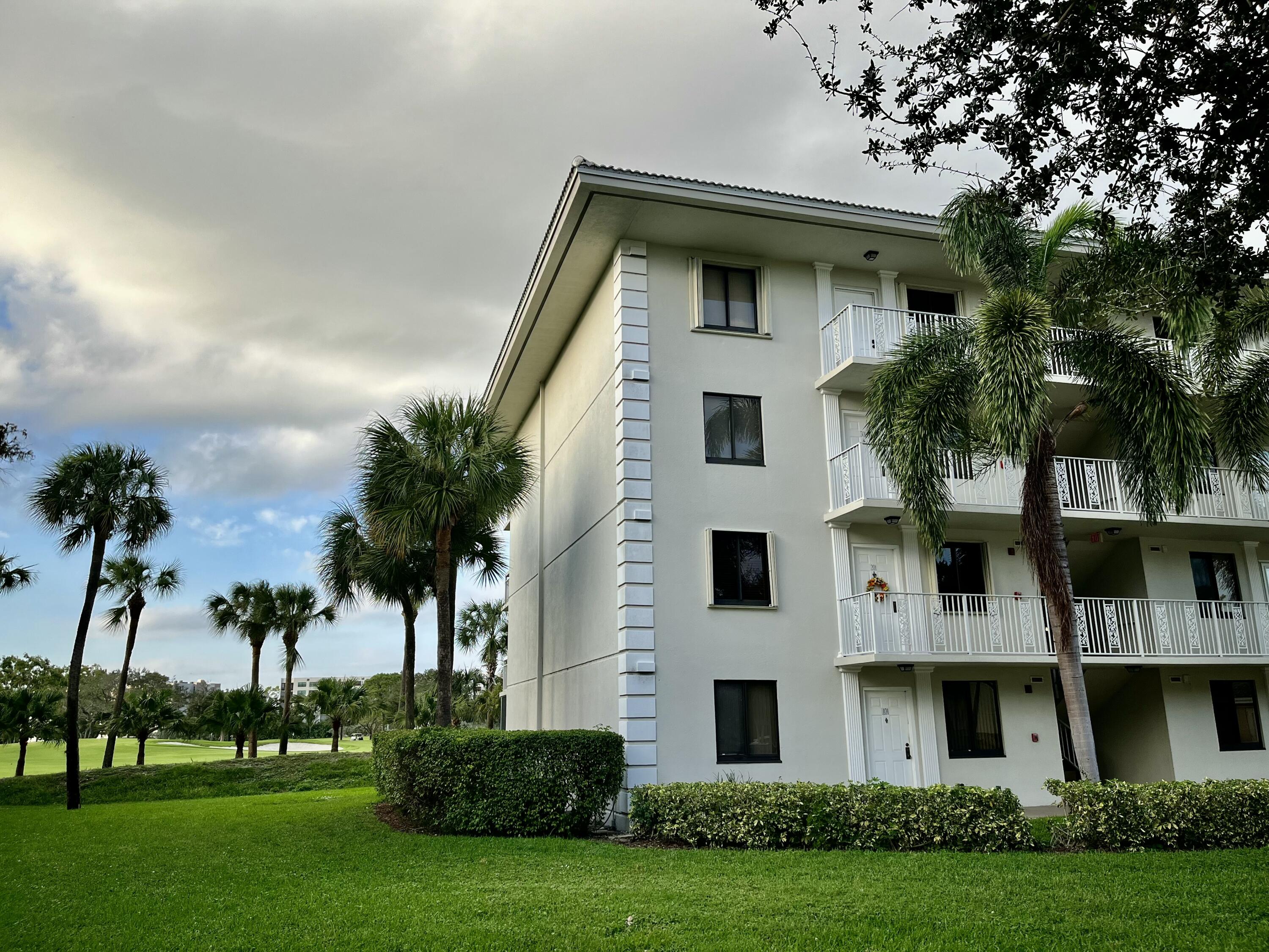 6169 Balboa Circle, Unit 401 Boca Raton, FL 33433 - Photo 34 of 34 a view of house with yard and green space