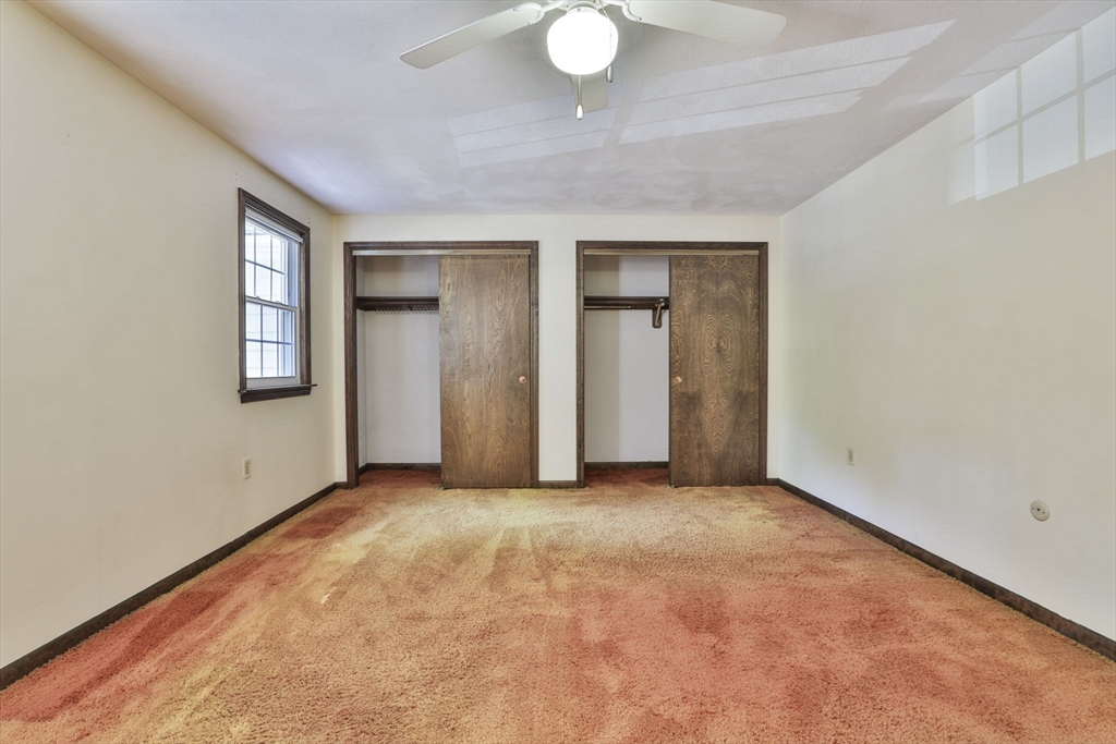 101 Drummer Road, Unit 101 Acton, MA 01720 - Photo 18 of 31 an empty room with windows