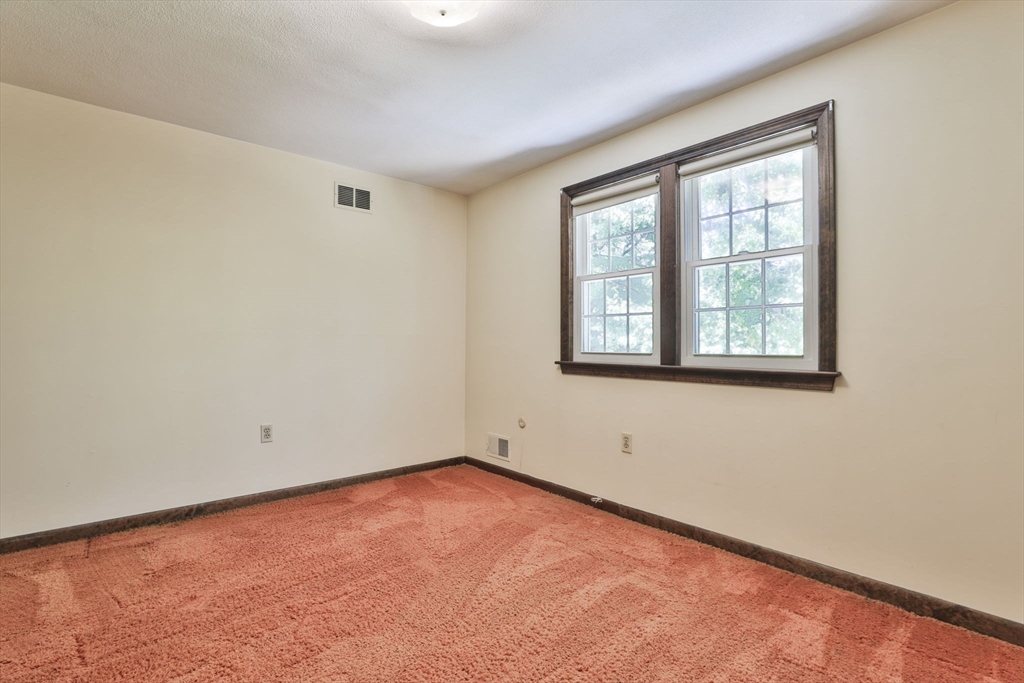 101 Drummer Road, Unit 101 Acton, MA 01720 - Photo 20 of 31 an empty room with a window