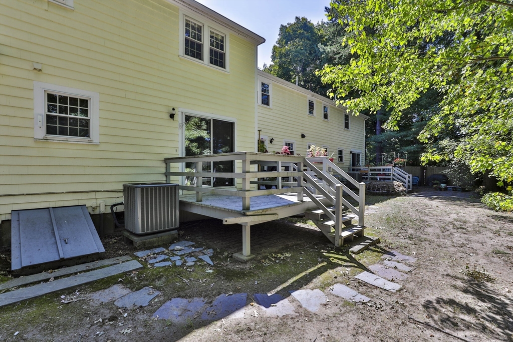 101 Drummer Road, Unit 101 Acton, MA 01720 - Photo 29 of 31 a view of a backyard with sitting area