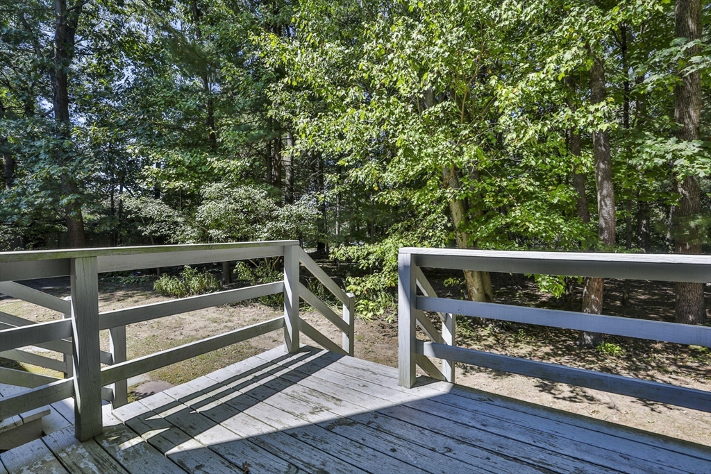 101 Drummer Road, Unit 101 Acton, MA 01720 - Photo 31 of 31 a view of outdoor space with wooden deck and furniture