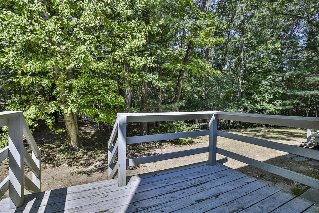 101 Drummer Road, Unit 101 Acton, MA 01720 - Photo 5 of 31 a view of balcony with wooden floor and outdoor seating
