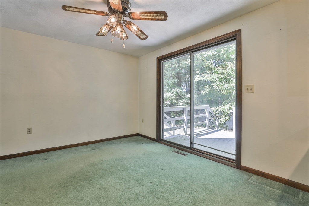 101 Drummer Road, Unit 101 Acton, MA 01720 - Photo 10 of 31 a view of a room with window and ceiling fan
