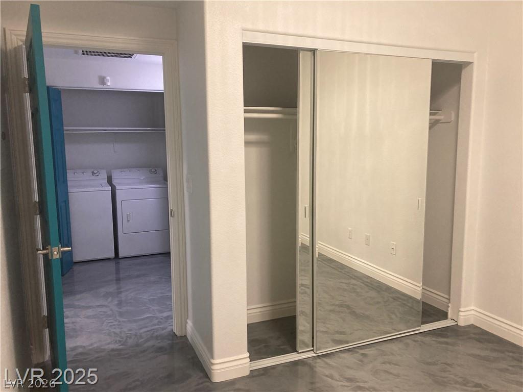 9050 West Warm Springs Road, Unit 1027 Las Vegas, NV 89148 - Photo 30 of 44 Functional laundry facilities within a versatile space with ample mirrored closet storage.