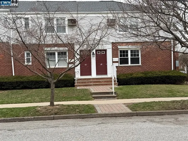 front view of a house with a small yard