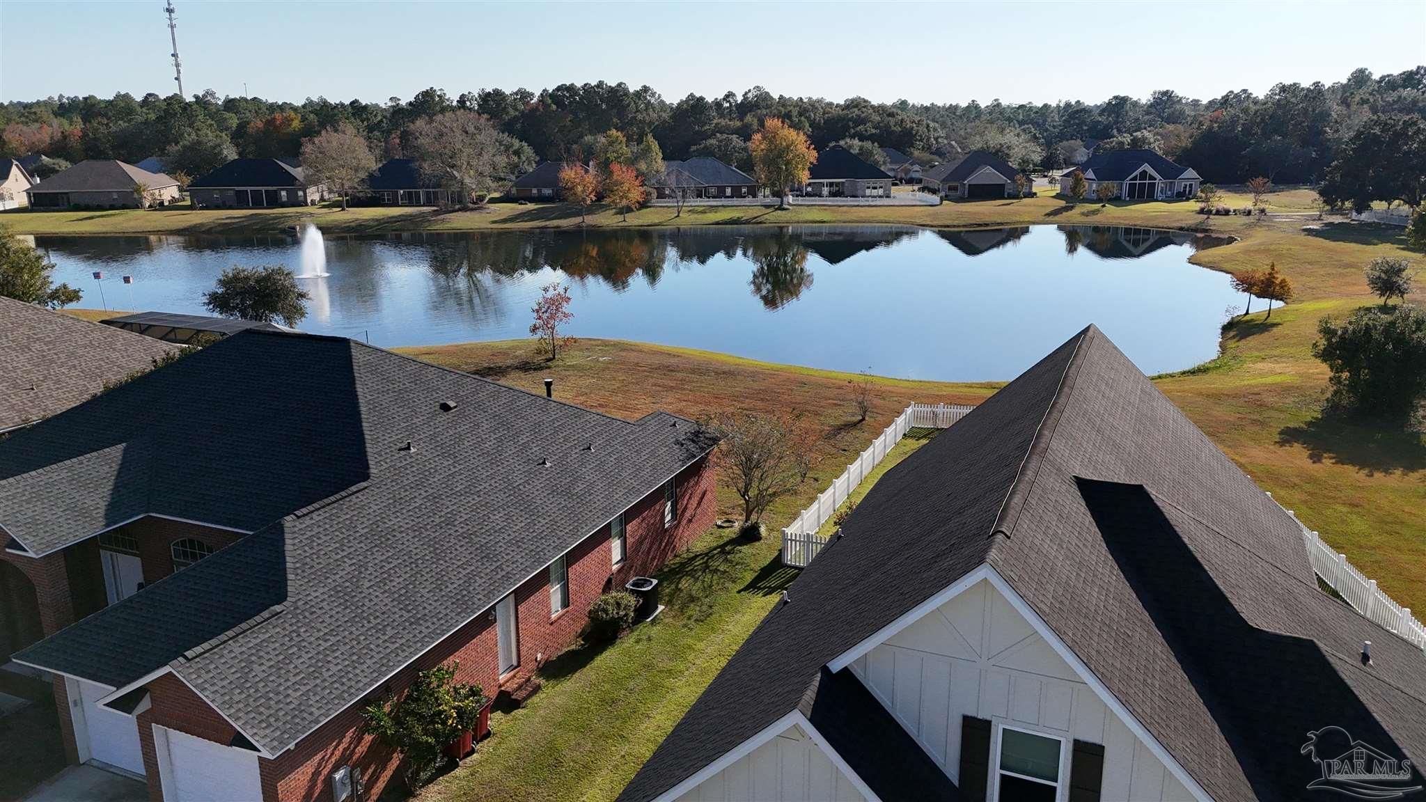 5642 Dunbar Circle Milton, FL 32583 - Photo 2 of 33 an aerial view of a house with lake view