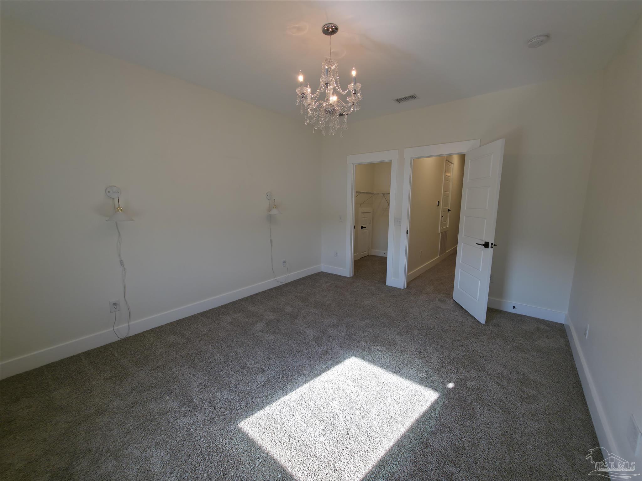 5642 Dunbar Circle Milton, FL 32583 - Photo 26 of 33 a view of a chandelier fan and entryway