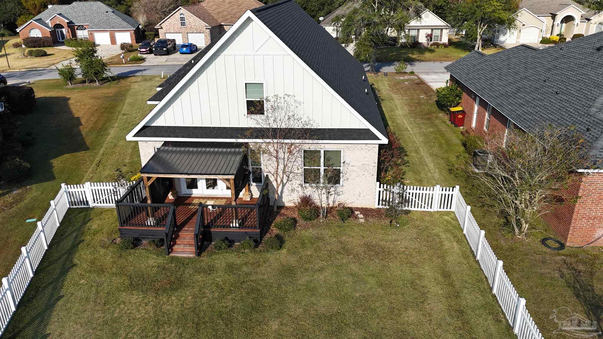 5642 Dunbar Circle Milton, FL 32583 - Photo 29 of 33 a view of a house with backyard porch and sitting area