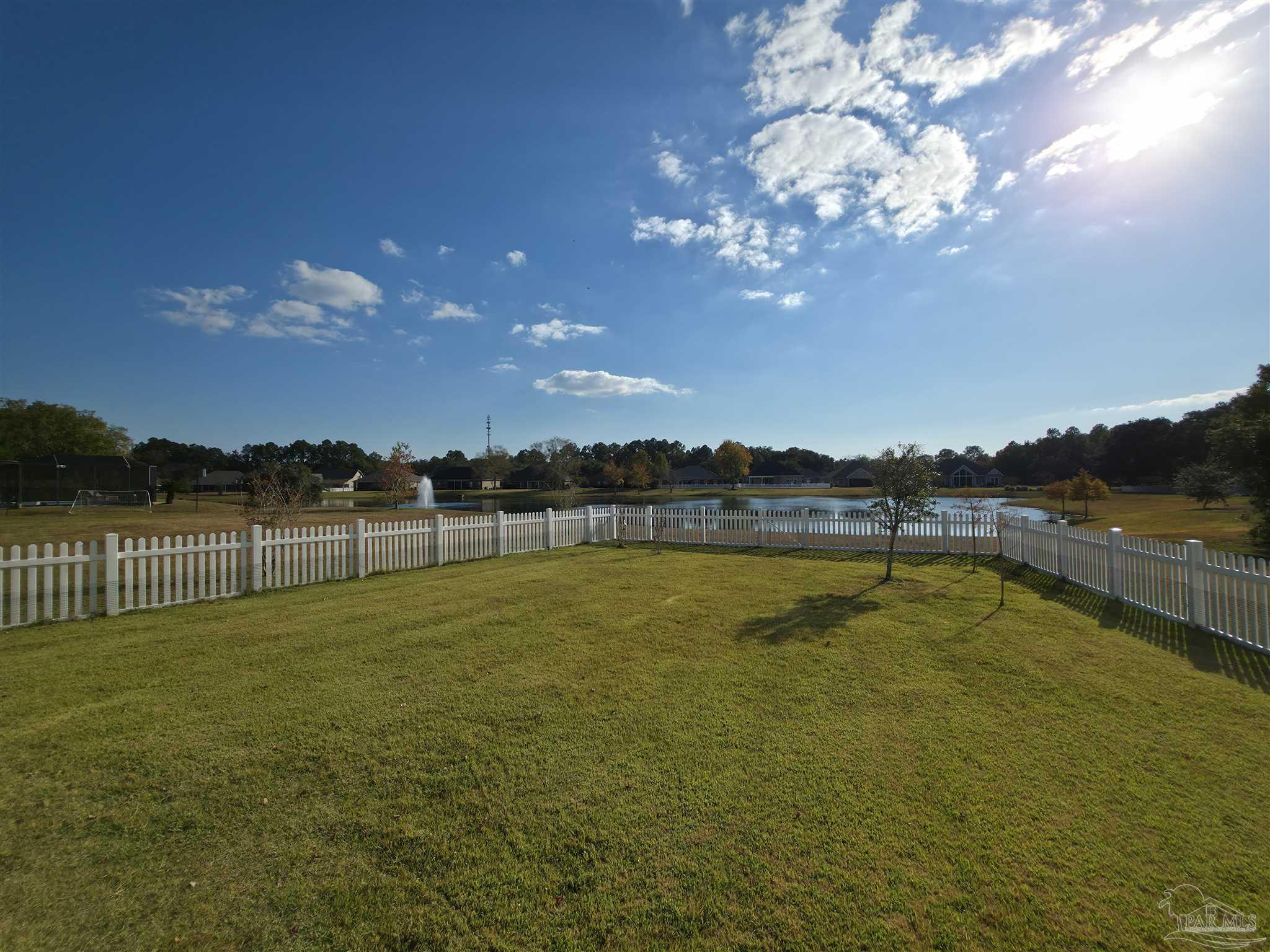 5642 Dunbar Circle Milton, FL 32583 - Photo 6 of 33 a view of a lake with a big yard