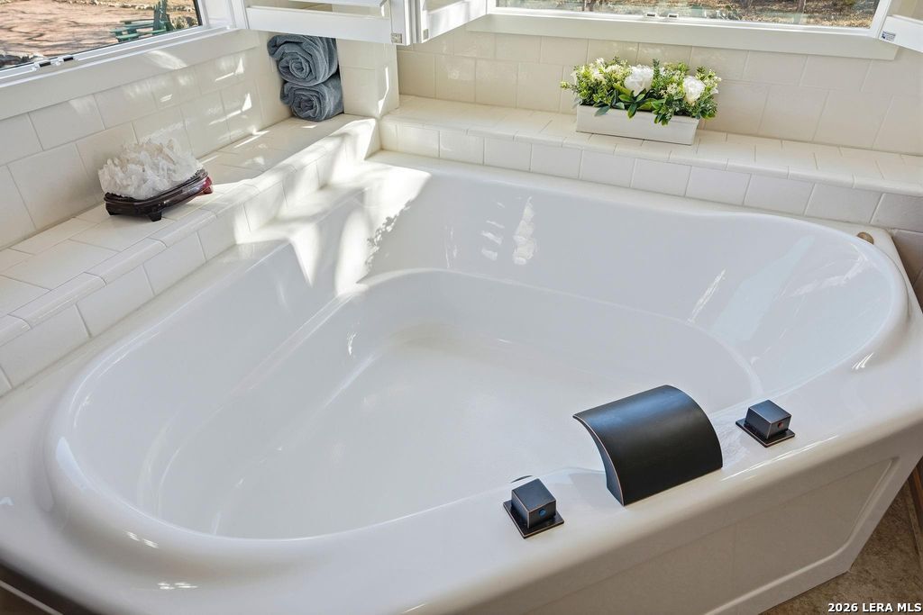 318 River Ridge Boerne, TX 78006 - Photo 21 of 46 a white bath tub sitting in a bathroom