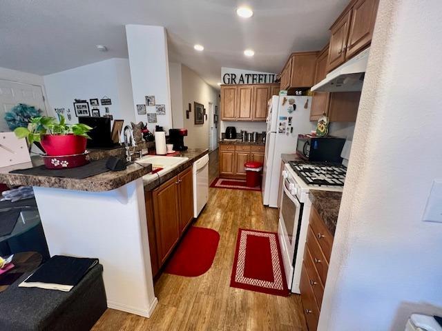 1650 Villa Avenue, Unit 9 Clovis, CA 93612 - Photo 14 of 29 a kitchen with sink refrigerator and stove