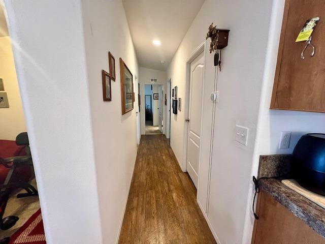1650 Villa Avenue, Unit 9 Clovis, CA 93612 - Photo 18 of 29 a view of a hallway with wooden floor and stairs
