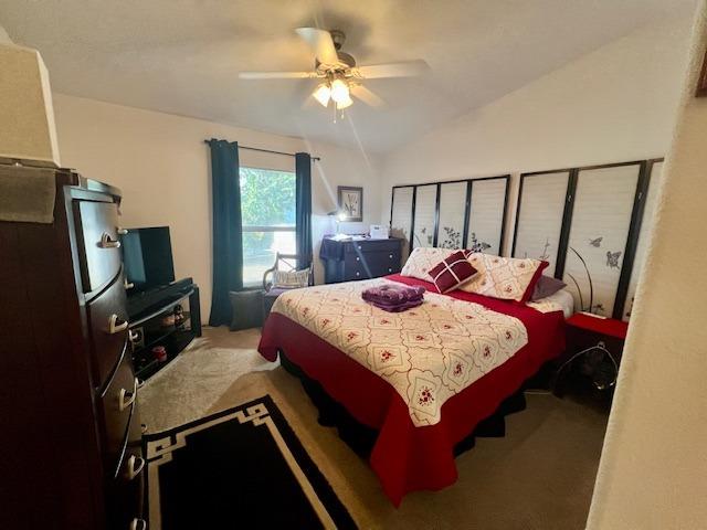 1650 Villa Avenue, Unit 9 Clovis, CA 93612 - Photo 20 of 29 a bed sitting in a bedroom next to a window