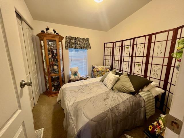 1650 Villa Avenue, Unit 9 Clovis, CA 93612 - Photo 22 of 29 a bedroom with a bed and wooden floor