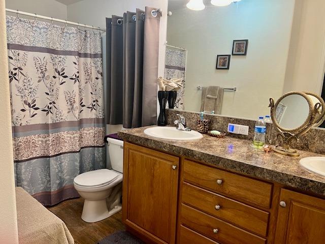 1650 Villa Avenue, Unit 9 Clovis, CA 93612 - Photo 24 of 29 a bathroom with a granite countertop toilet sink and shower