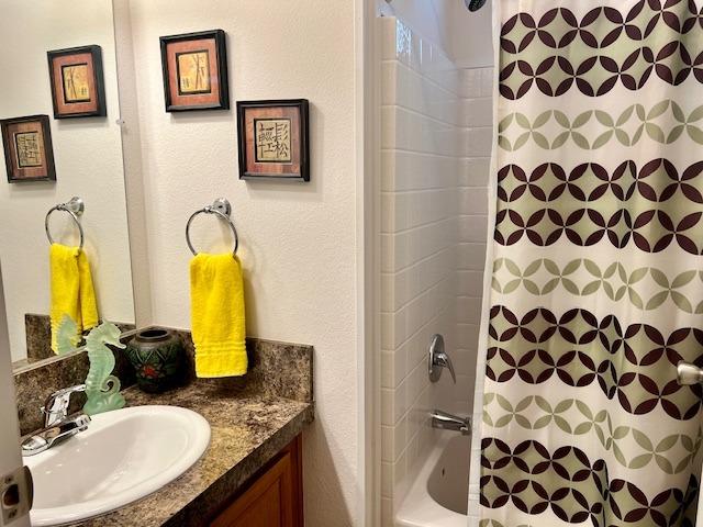 1650 Villa Avenue, Unit 9 Clovis, CA 93612 - Photo 26 of 29 a bathroom with a granite countertop sink and a mirror