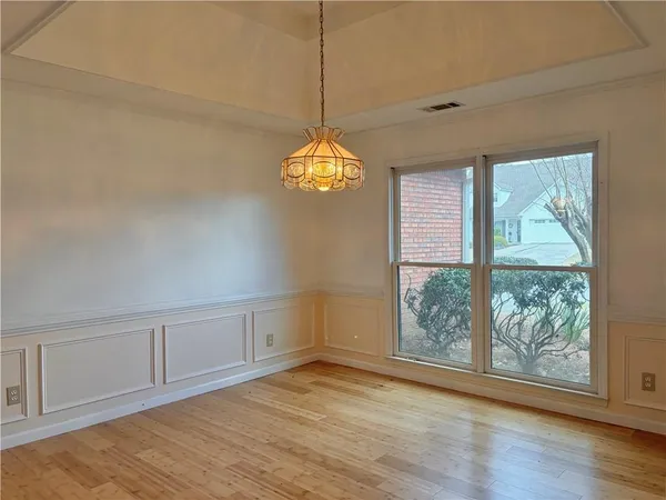 a view of a room with window and chandelier